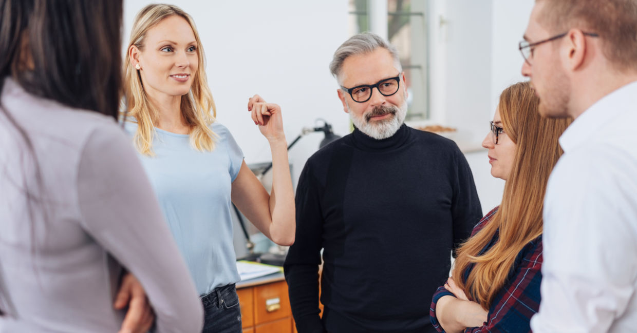 A group practices family constellations therapy.