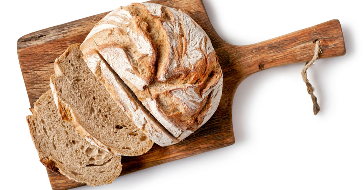 A partially sliced loaf of bread.