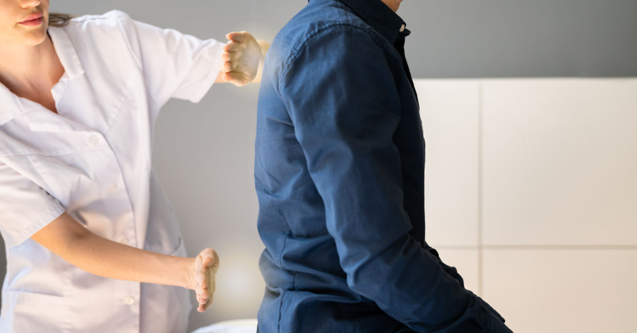 A man receives reiki for pain and mobility.