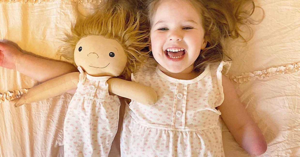 Girl playing with her customized doll thanks to Amy Jandrisevits of A Doll Like Me