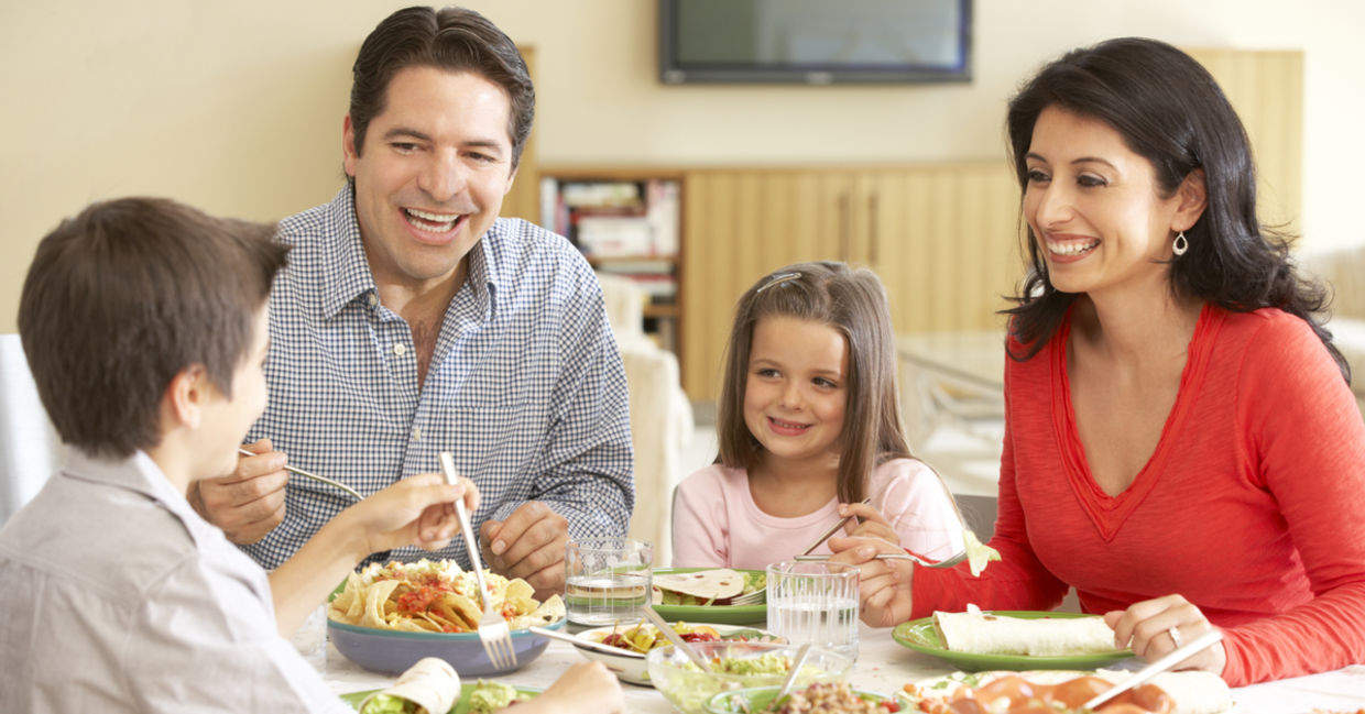 Young family enjoying a meal at home.
