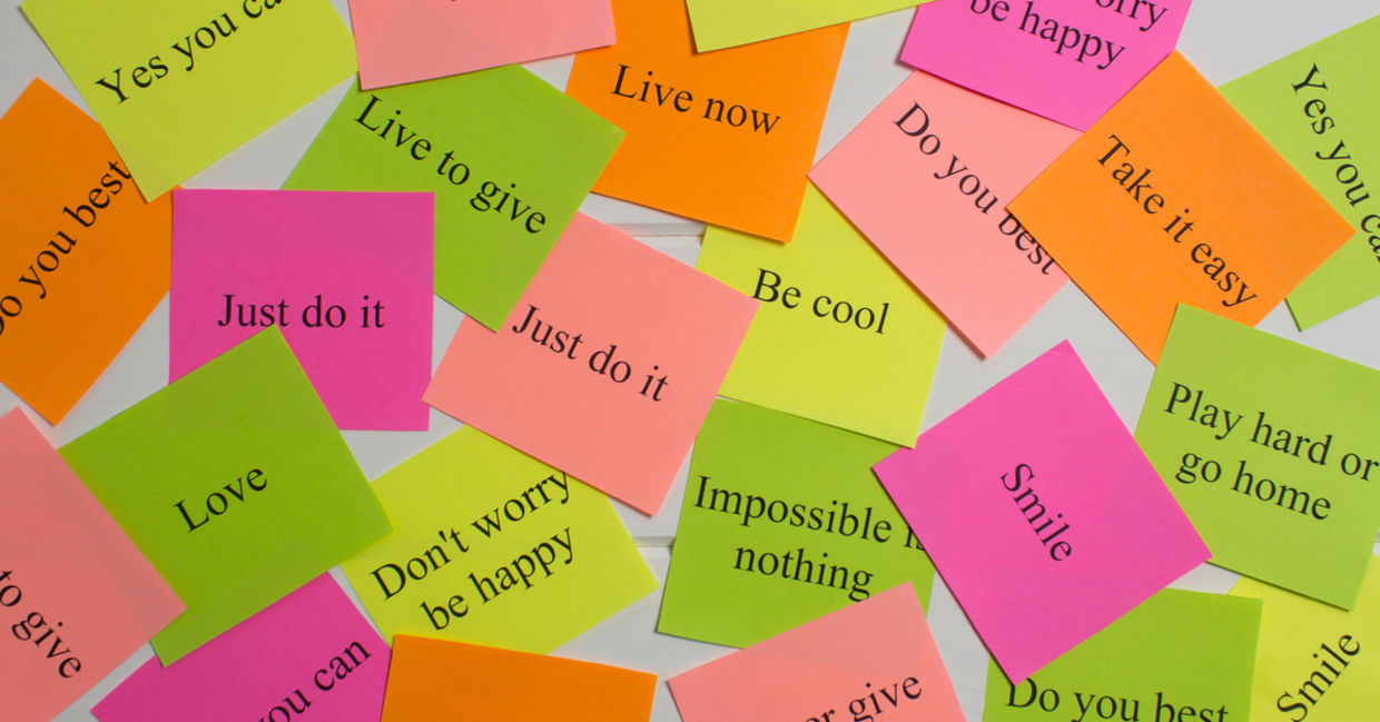 Motivational words on bright cards.