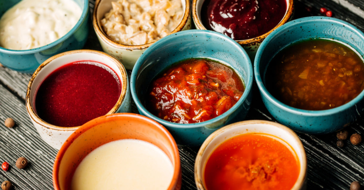 Bowls of various healthy vegan condiments.