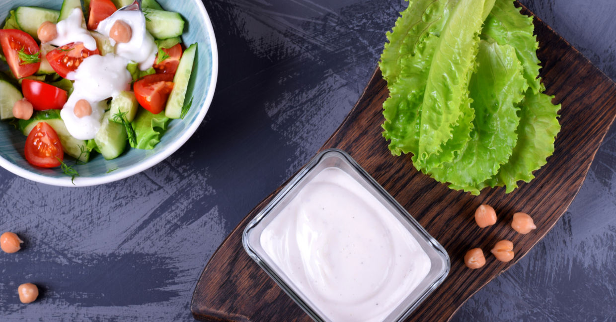 Vegan chickpea mayo made with aquafaba served on vegetables.