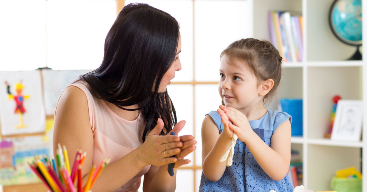 Mother and her daughter deep in conversation while doing art.