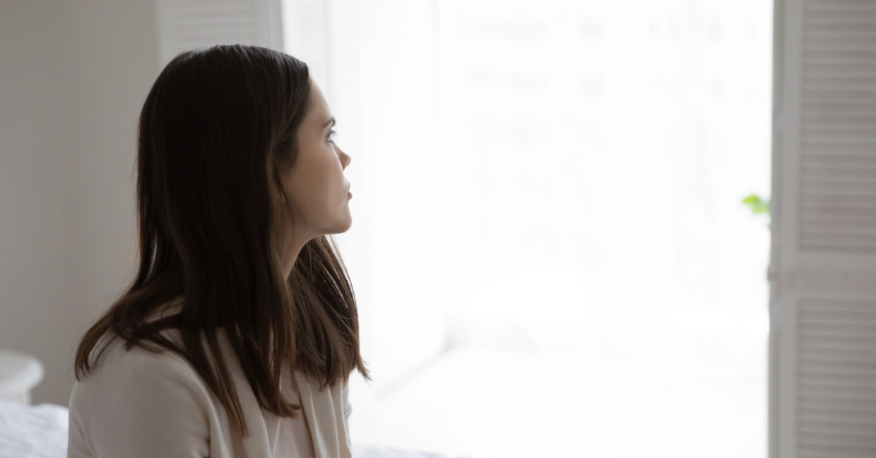Thoughtful millennial woman thinking about her anxiety.