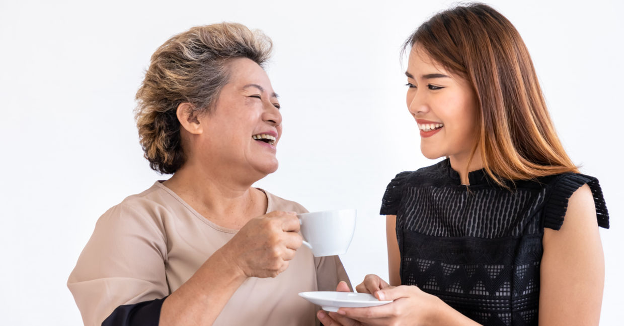Young woman compassionately caring for an elder family member.
