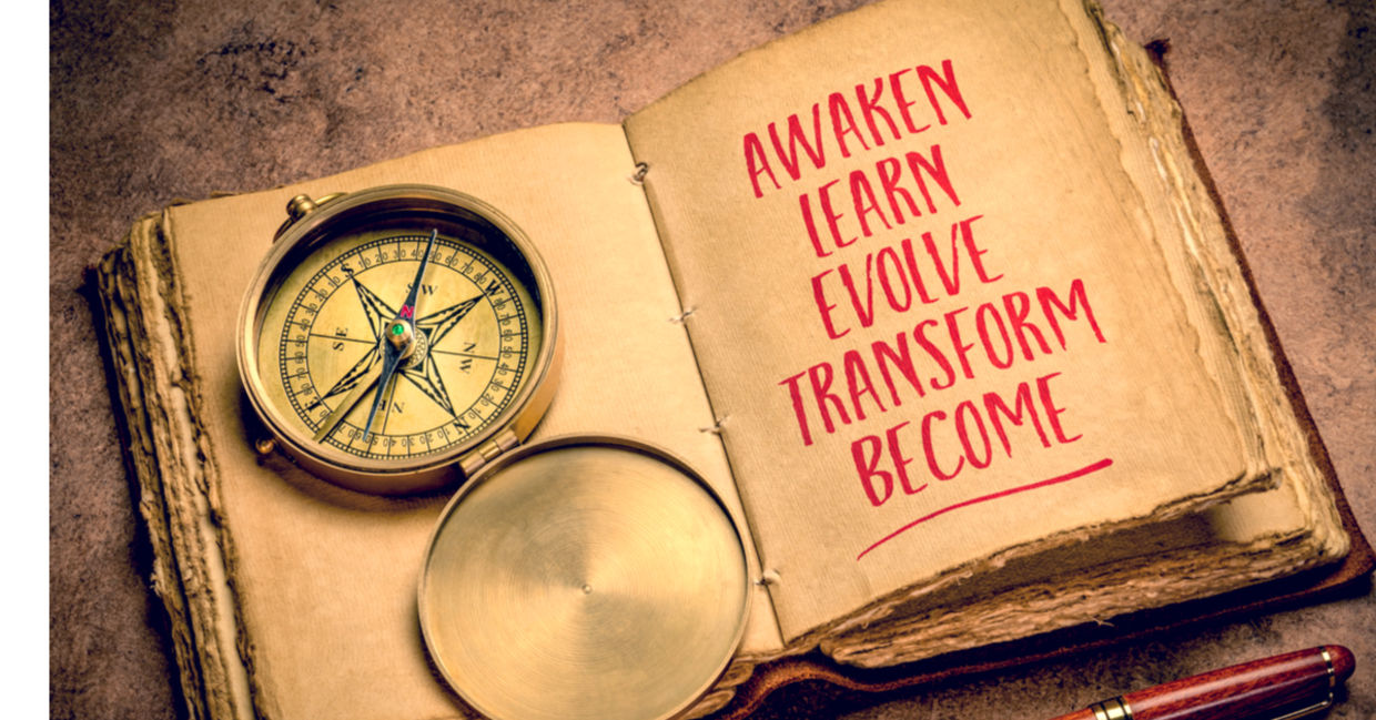 Writing about goals in an antique journal.