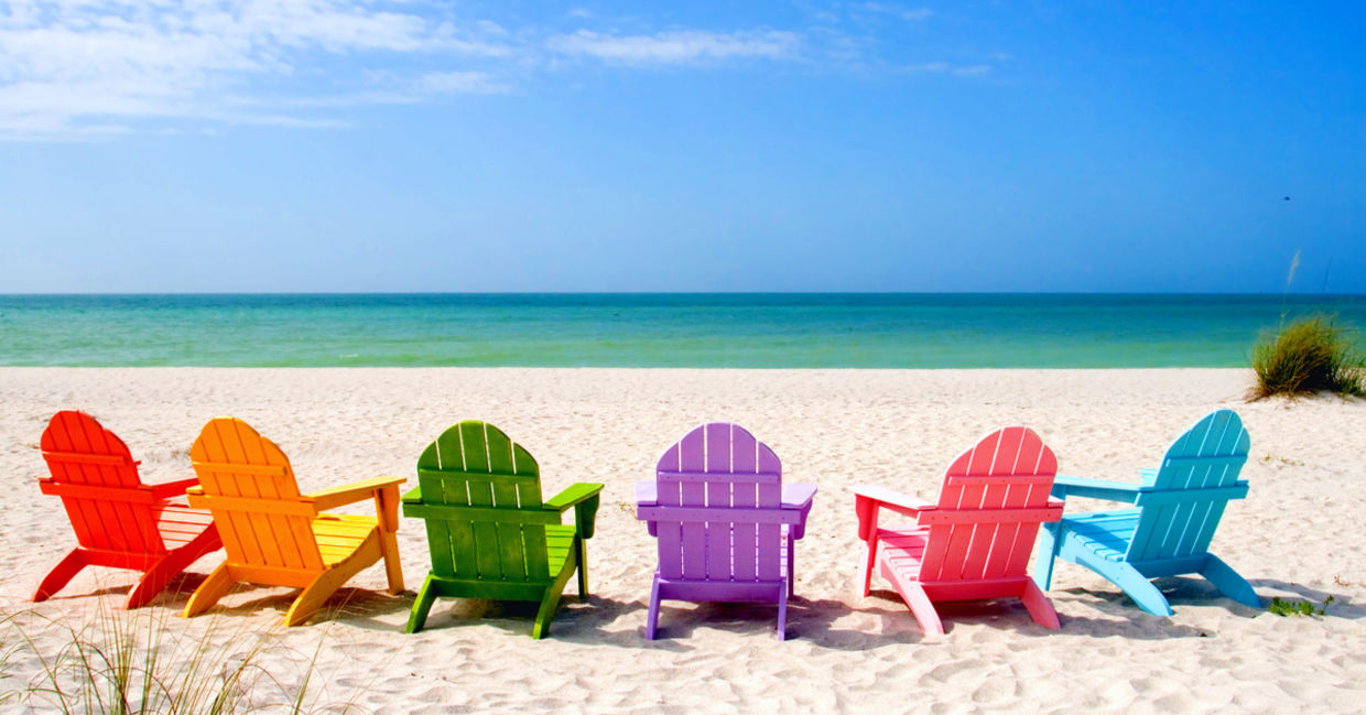 Colored chairs on a scenic shore suggesting positive potential.