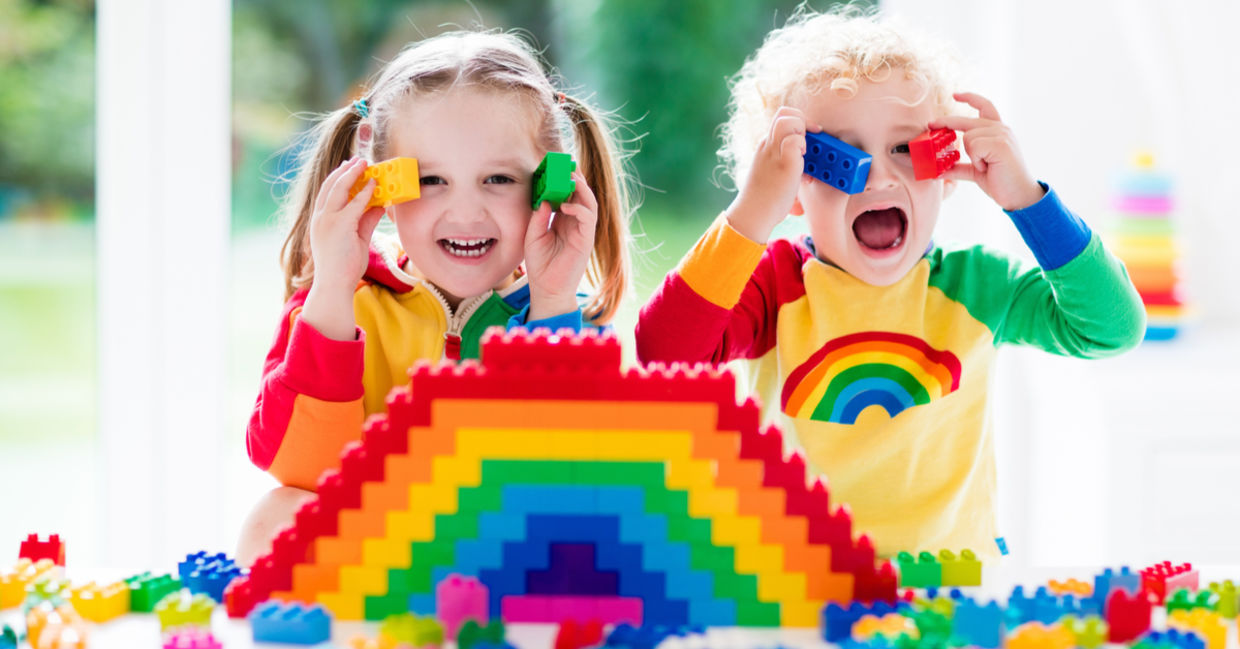 Kids playing with LEGO bricks.