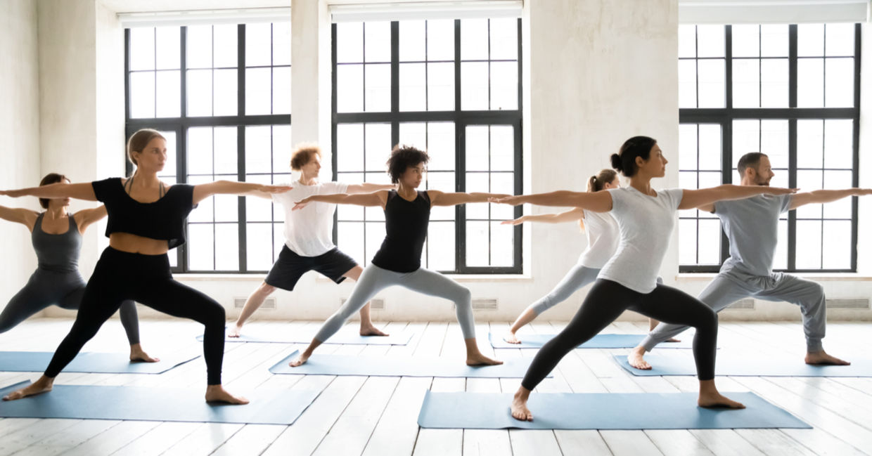 Group of people practicing yoga asanas to improve physical and mental endurance.