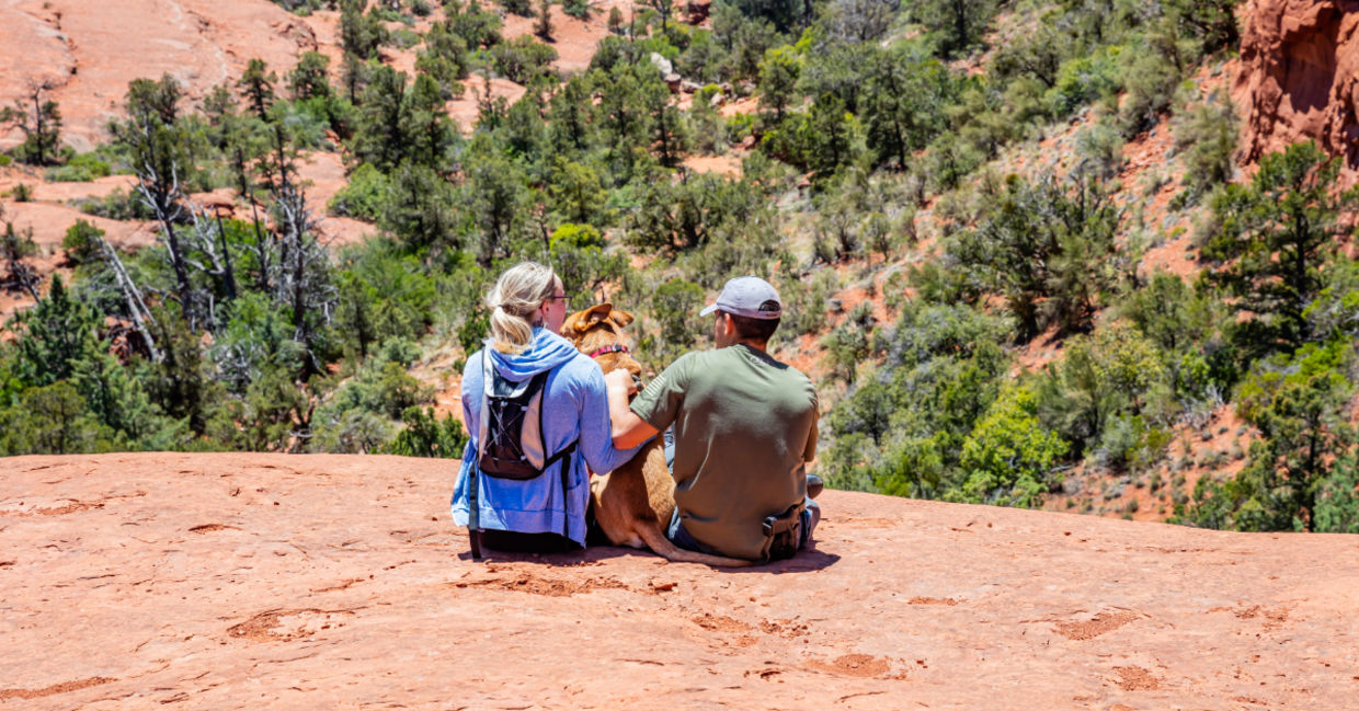 Hiking around Sedona with their pet.