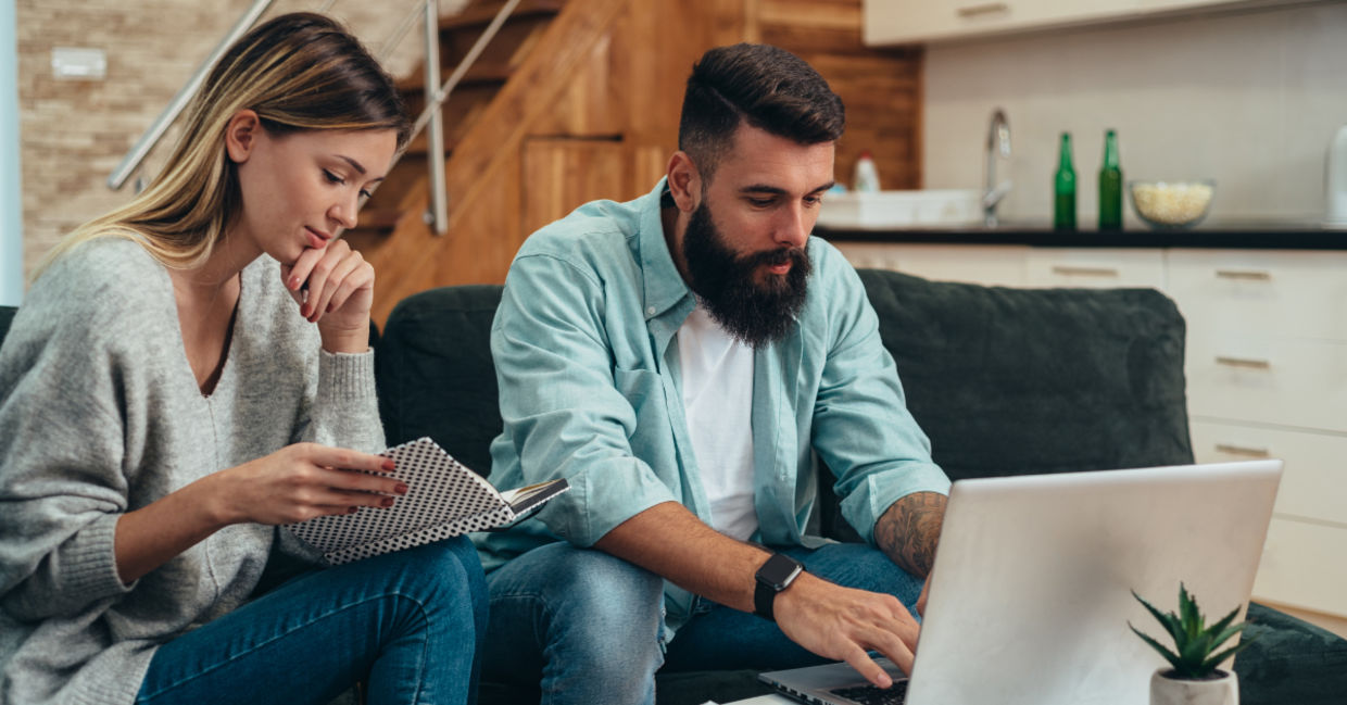 A man typing on a laptop.