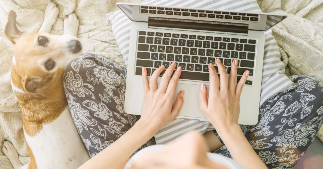 Typing on a laptop keyboard.