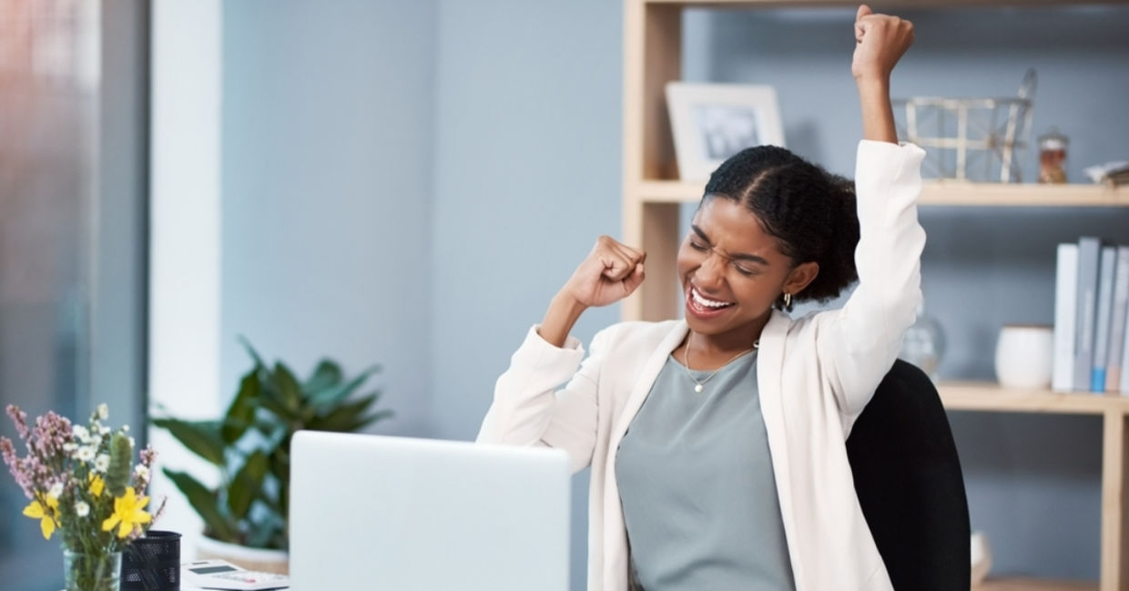 Happy businesswomen in her customized office.