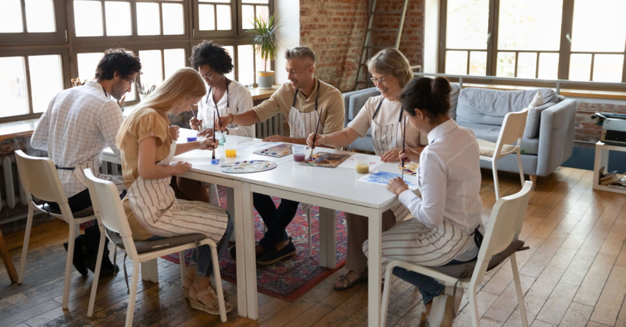 Multi-aged adults taking an art class