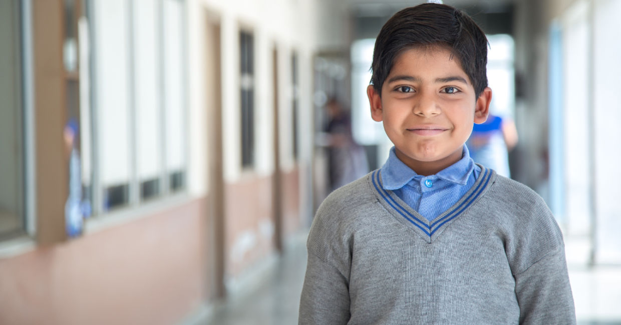 A little child with a uniform.