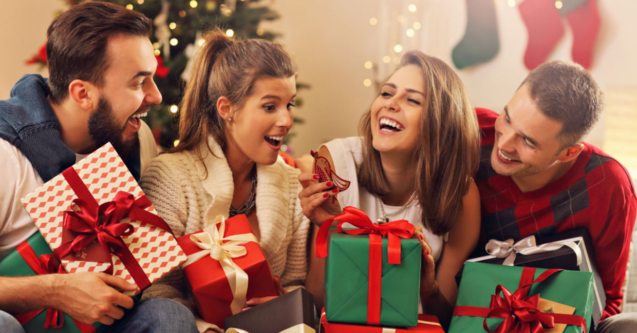 A group of friends celebrate by giving a consumable gift.