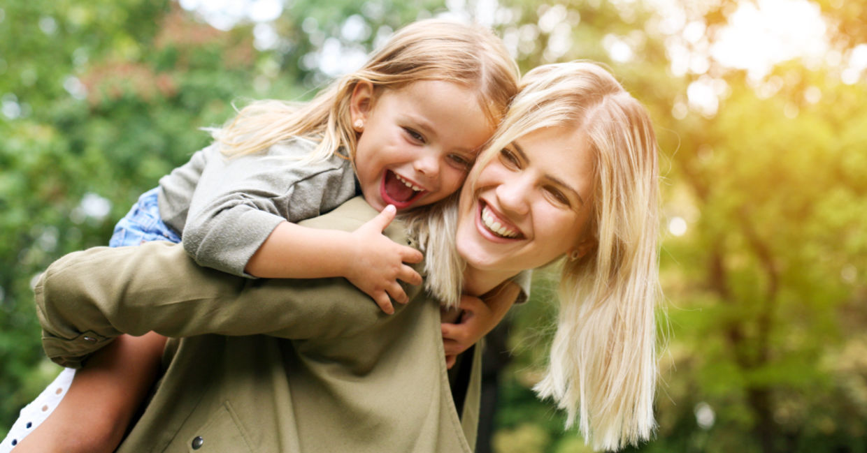 A young girl with her mother.