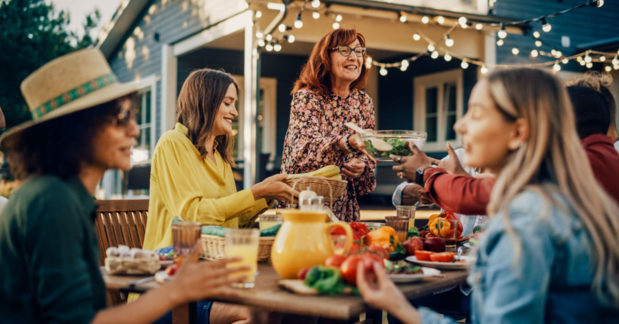 Family laughing and talking together at family gathering