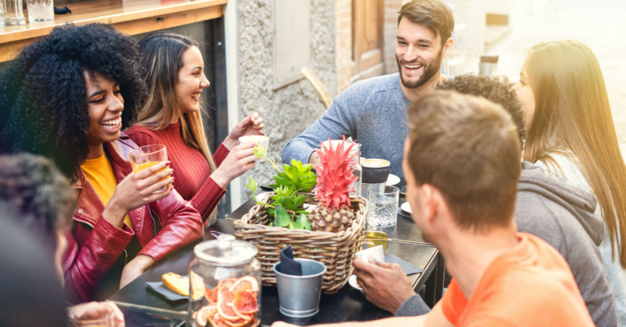 A group of friends enjoying a meal together at a restaurant.