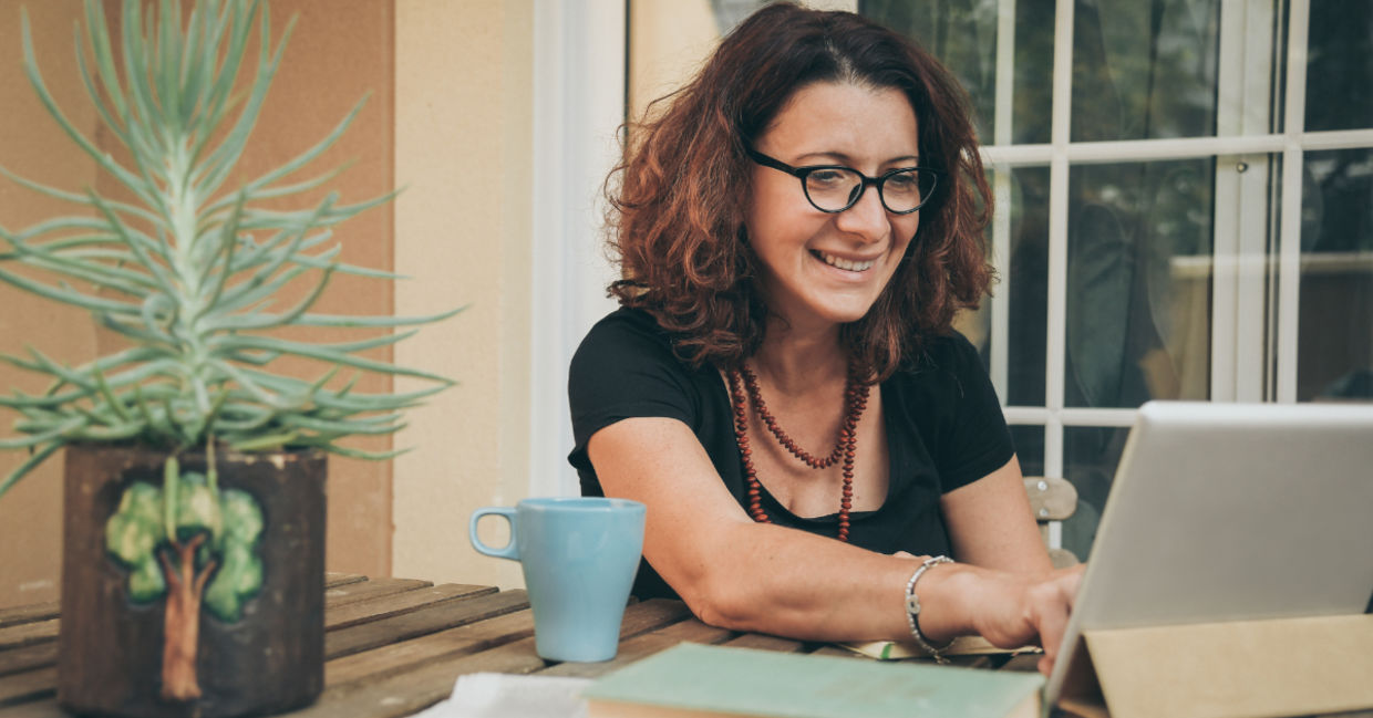 A woman studying at home .