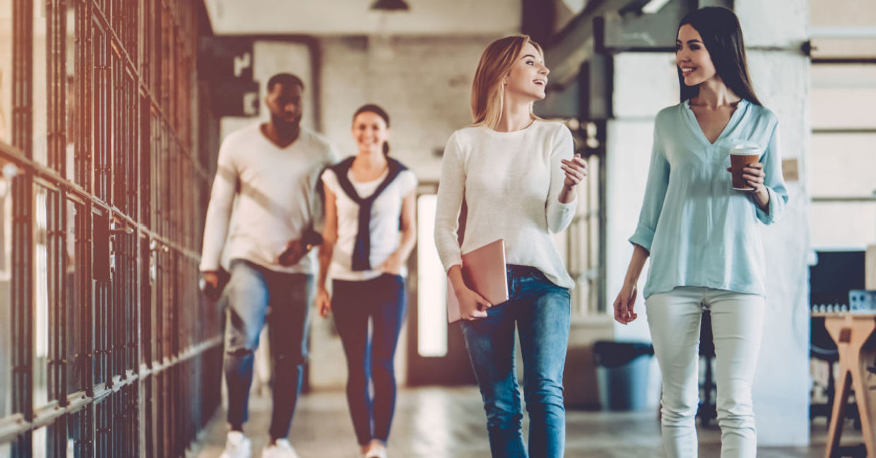 Office workers take a break from desk work and enjoy a healthy walk.