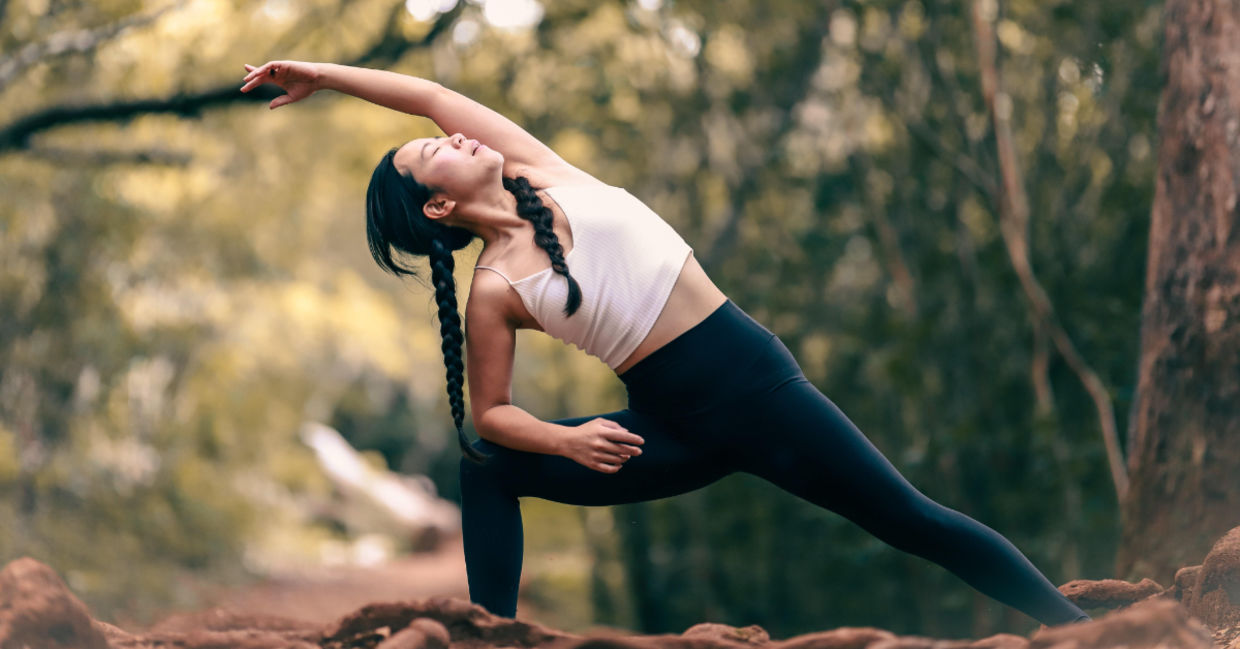 Woman in the extended side angle yoga pose.