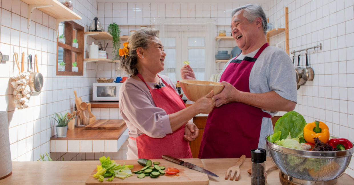 Senior couple preparing a healthy meal.