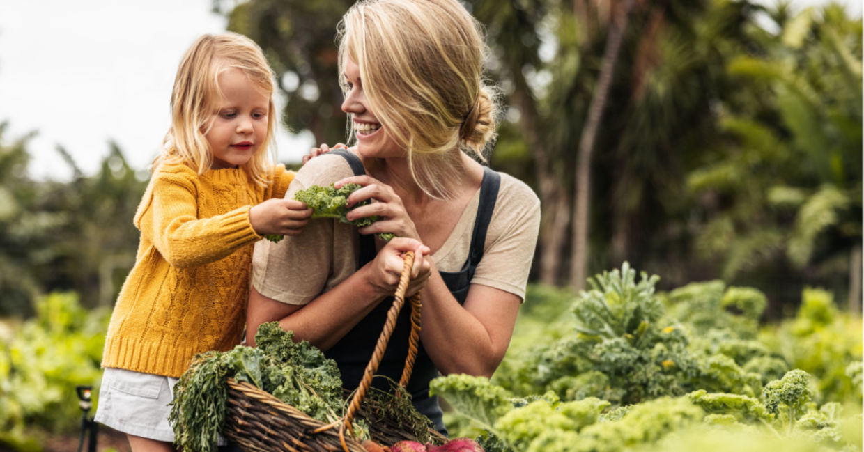 A mother and child in an organic garden.