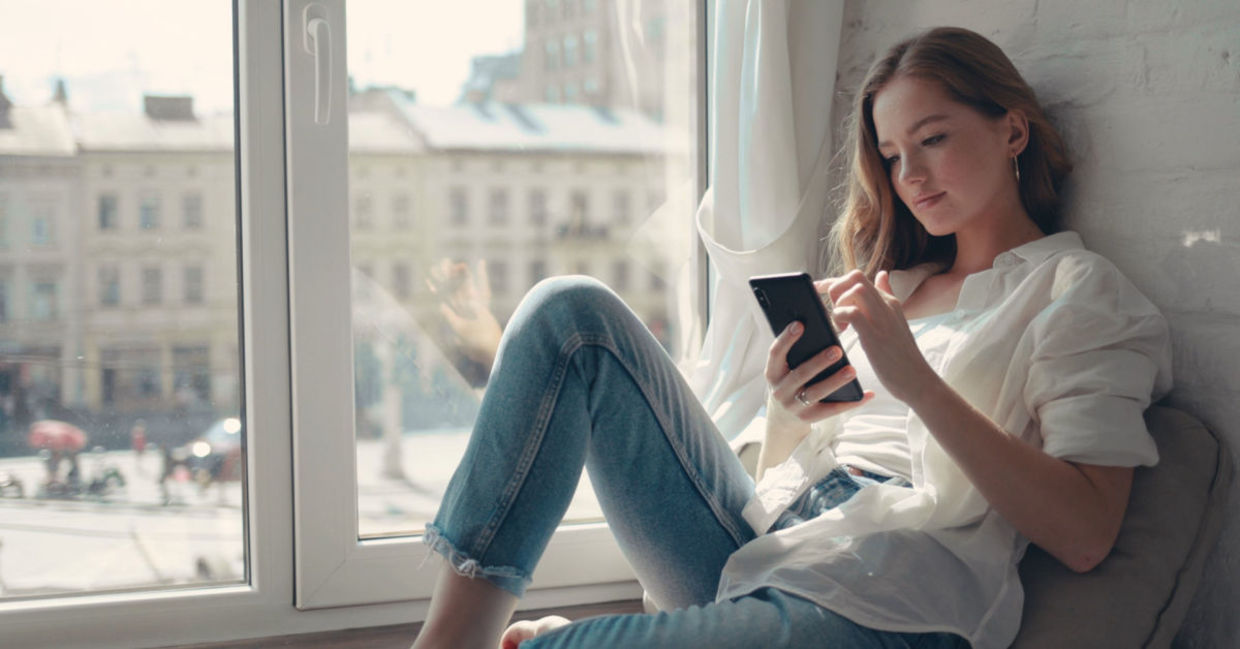 Young woman using a mental health app.