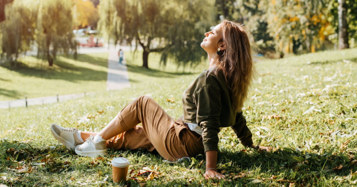 Woman relaxing in nature during her lunch break.