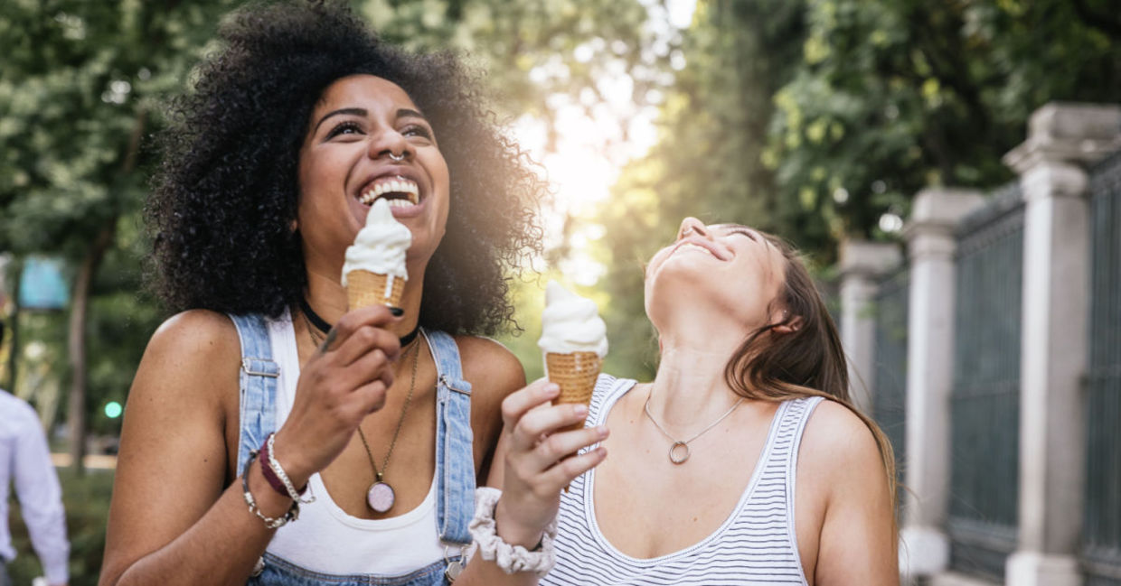 Two friends enjoying ice cream.