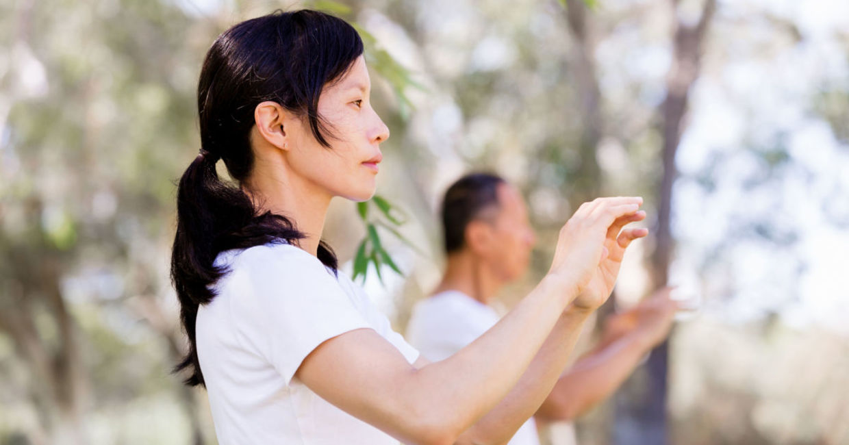 Woman practicing tai chi.