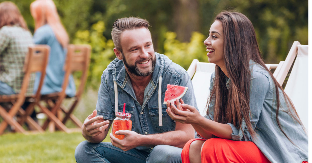 Enjoying watermelon at a summer barbeque.