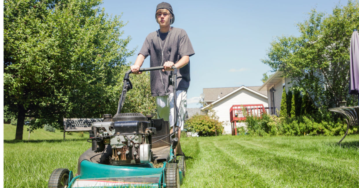 Teen cutting grass for people in need.