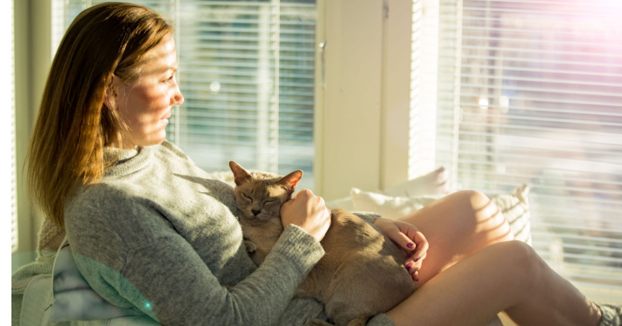 Woman in sunny room.