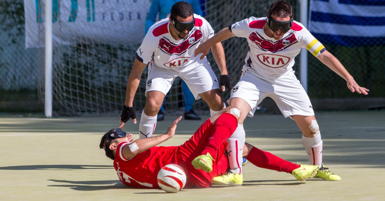 Playing blind soccer.