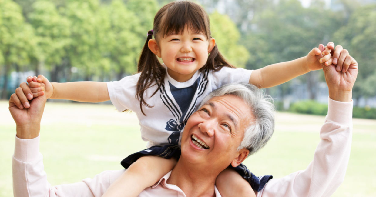 A woman babysitting her granddaughter.