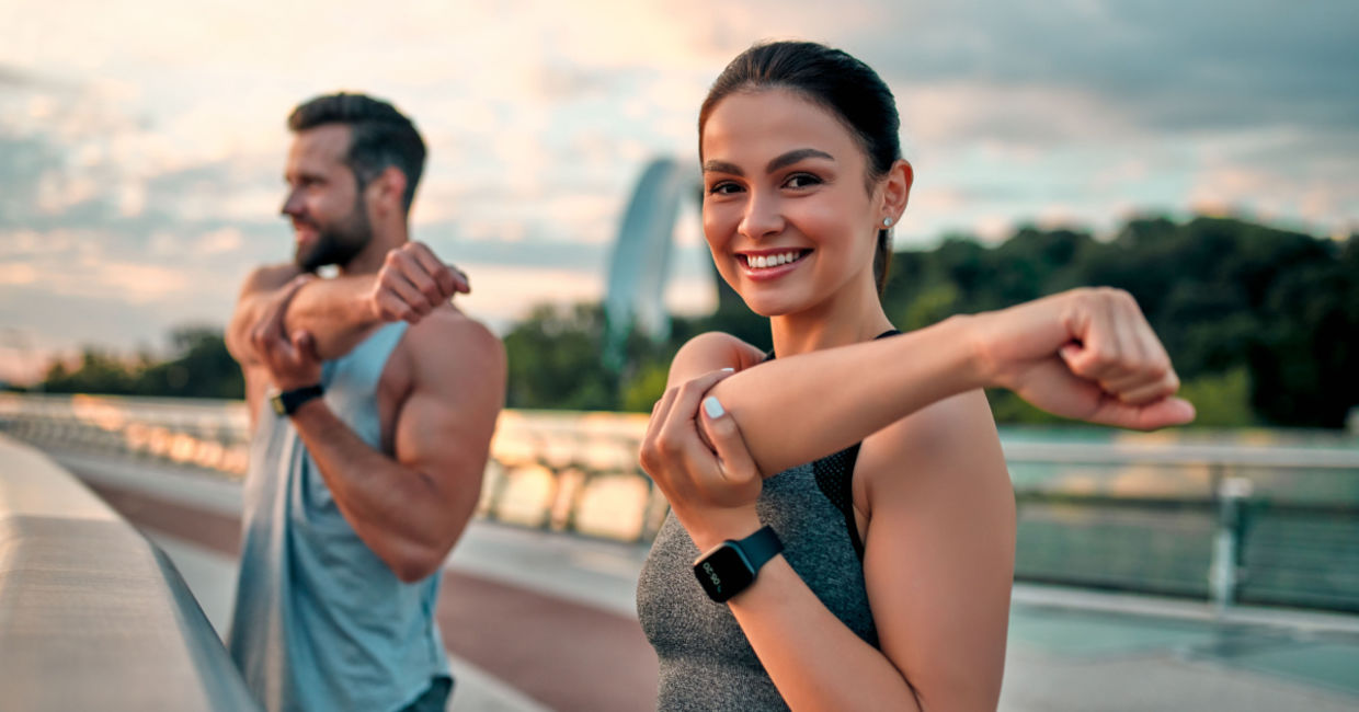 Two physically fit people who use supplements to stay fit in the summer.