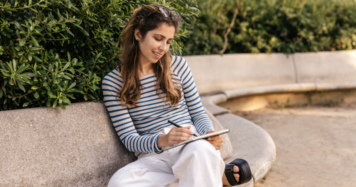Woman writing down her thoughts.