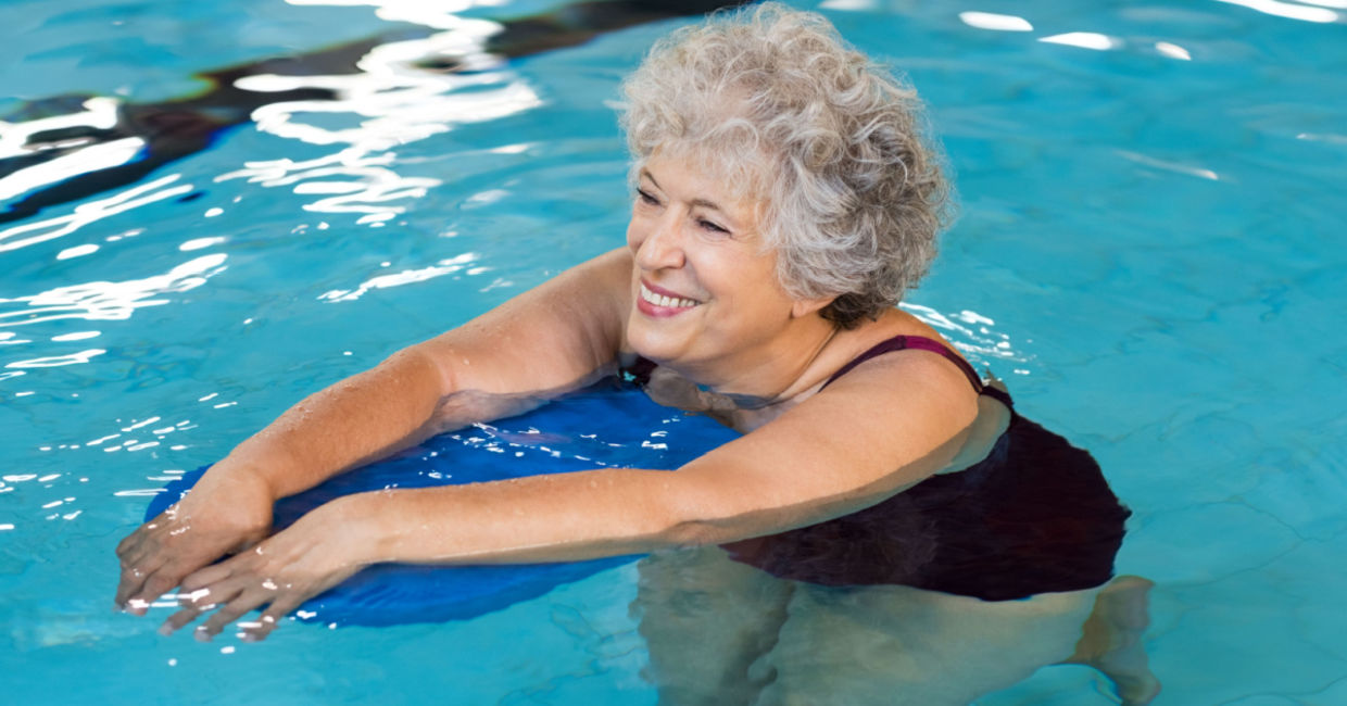 Exercising with a kickboard.