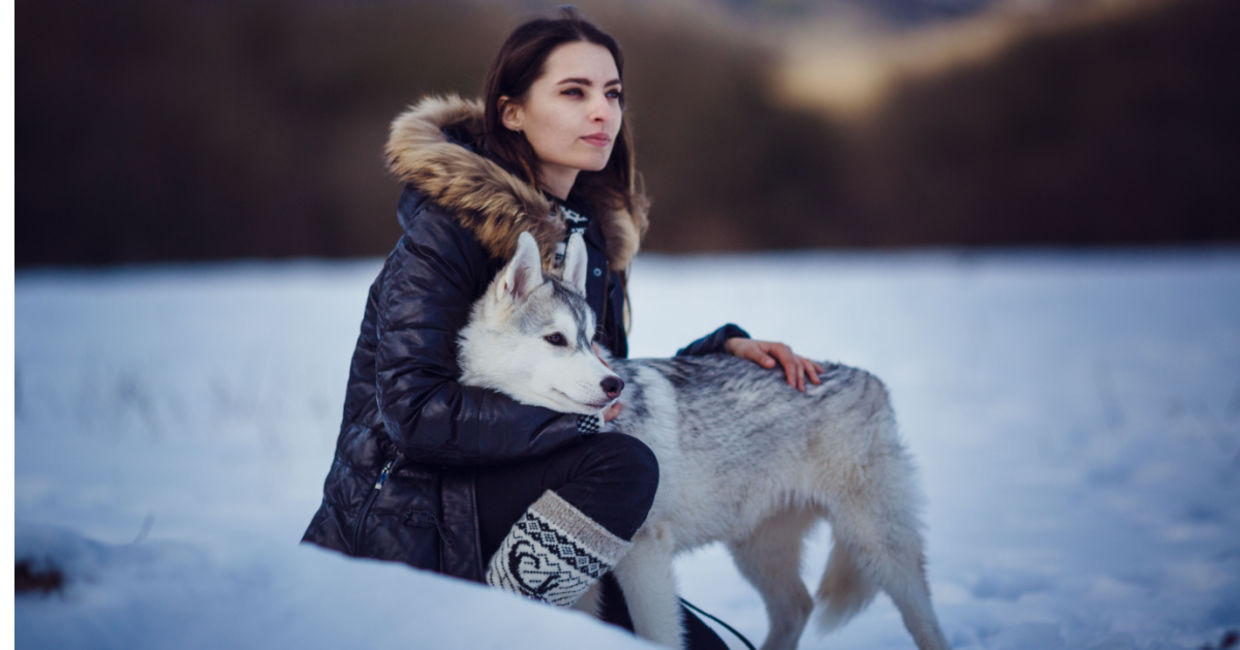 Indigenous woman with her dog companion.