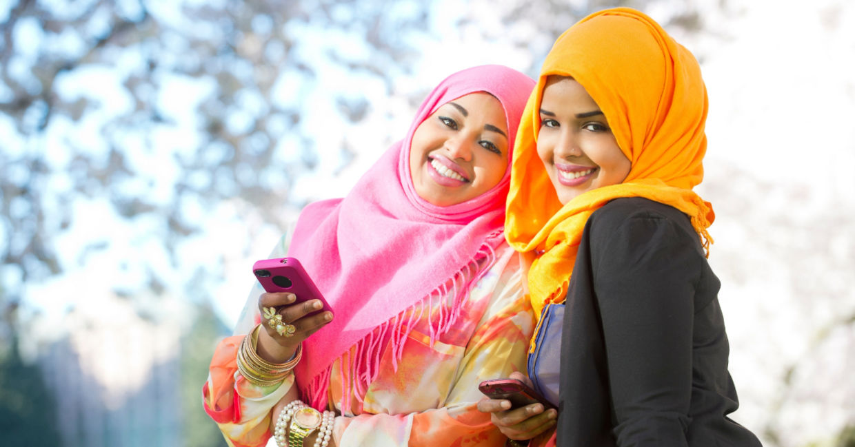 Two young Somali women using an app.