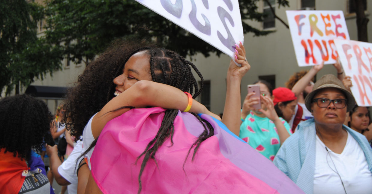 Giving a  stranger a hug is an act of kindness.