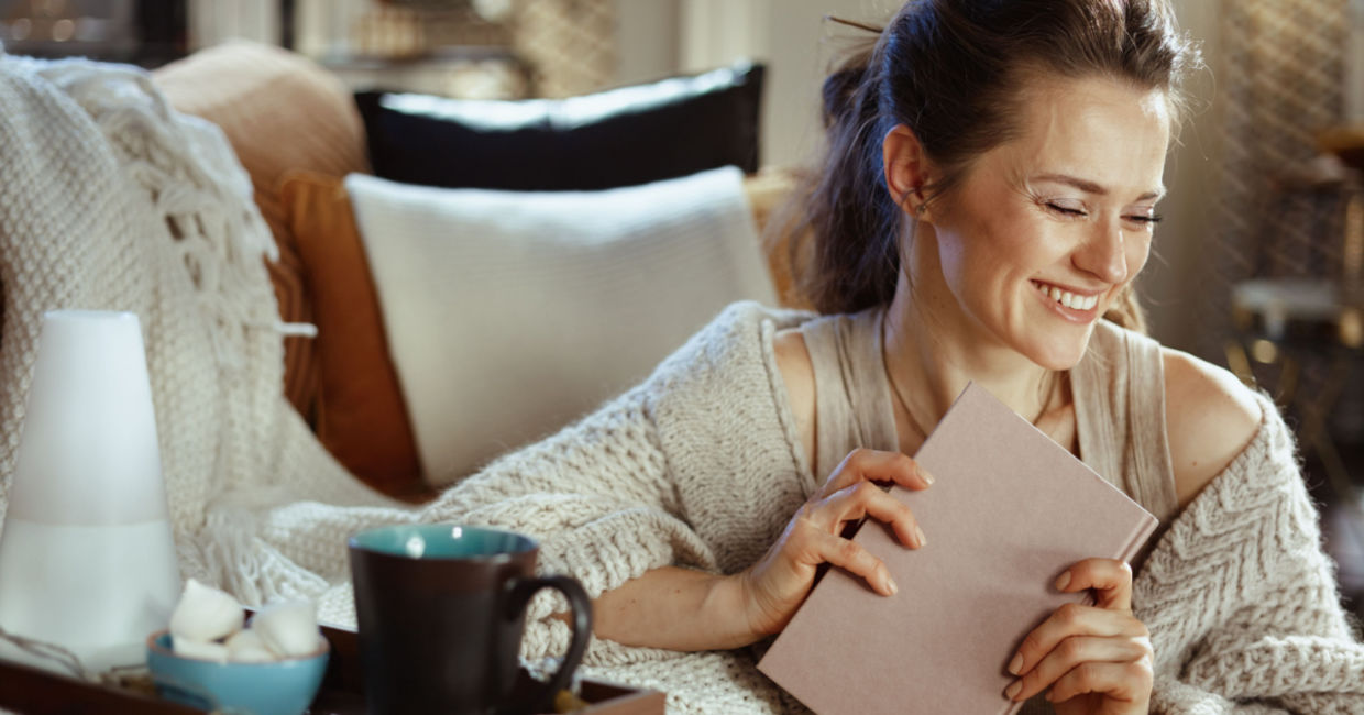 a woman embracing hygge.