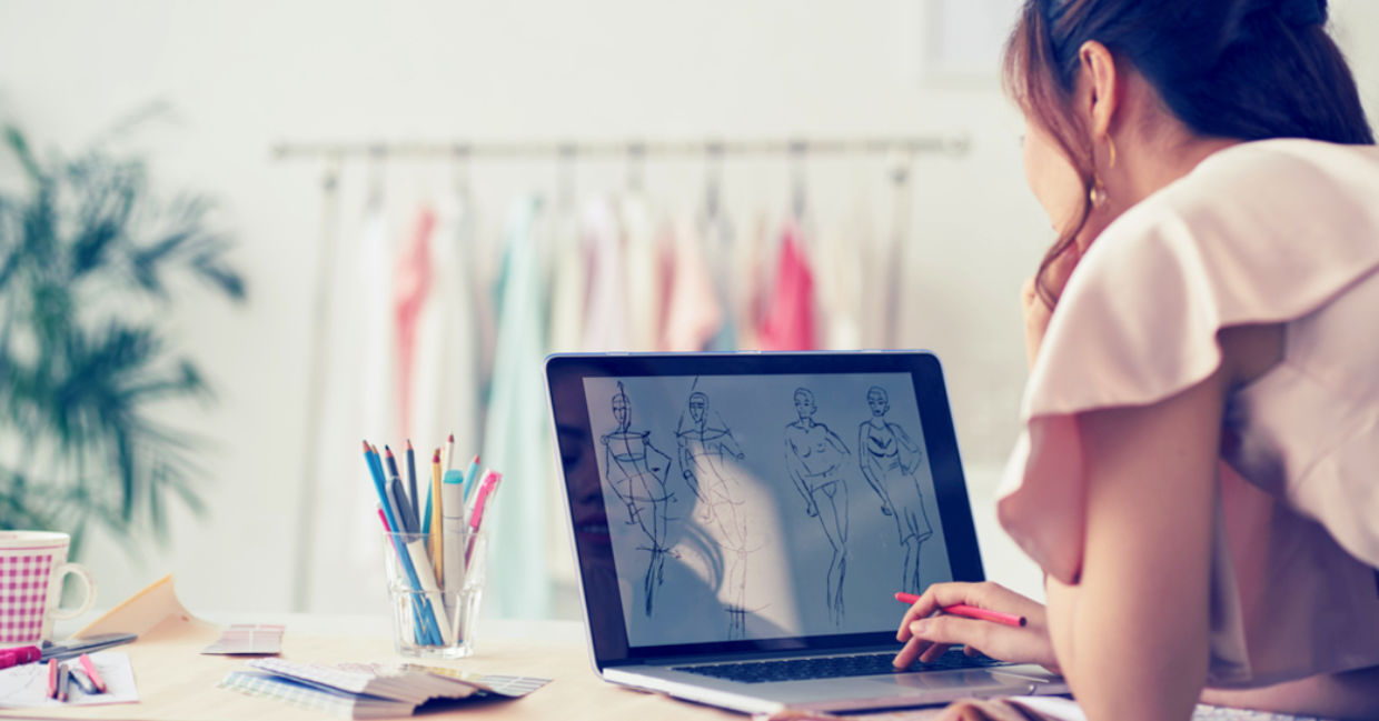 Fashion designer drawing sketches for new collection.