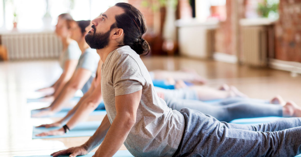 Yoga class practicing the cobra pose.