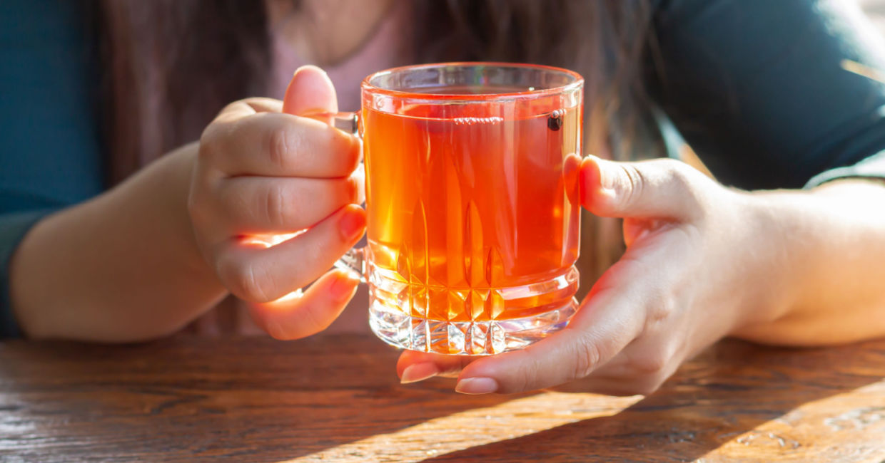 Enjoying a healthy cup of kombucha tea.