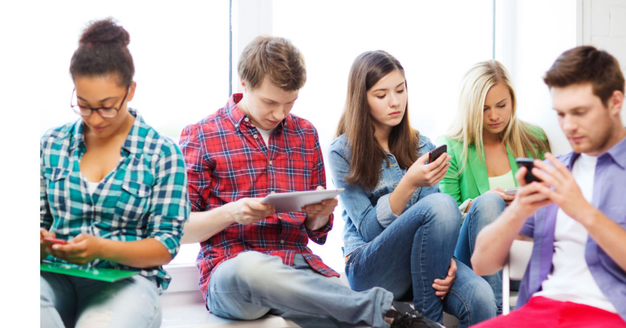 Students using smart devices.